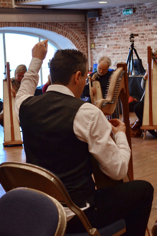 Erik teaching a harp class